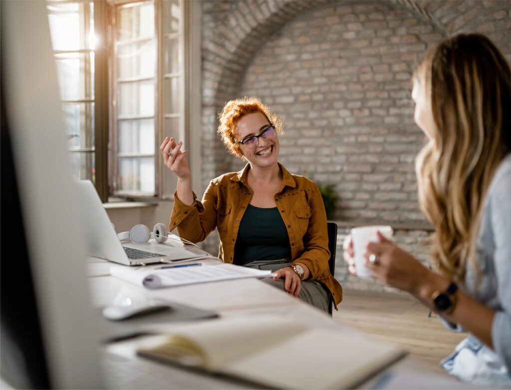 Kate Edwards HR consultancy services, two women having a conversation in the office.